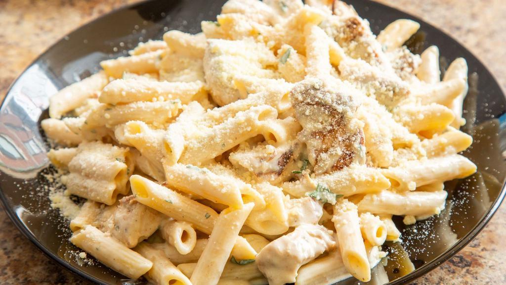 Chicken Alfredo Pasta Bundle · Sauteed in creamy Alfredo sauce with fresh garlic, fresh parsley and tossed with Romano cheese. Served with choice of penne pasta or linguine and a house salad with your choice of dressing. Served with your choice of Coca-Cola product.