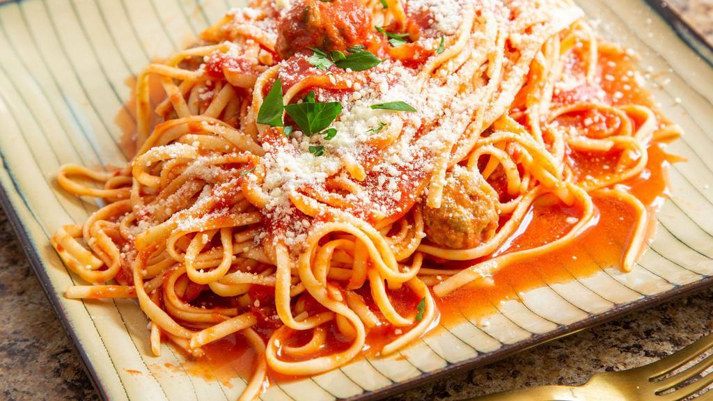 Pasta And Meatballs · Meatballs, marinara sauce tossed with Romano cheese, served with choice of penne pasta or linguine and a salad with your choice of dressing.