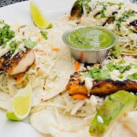 Blackened Fish Tacos · cobia, avocado, cotija cheese, cabbage slaw, crema, cilantro