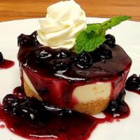 Ny Style Cheesecake · graham crust, blueberry sauce