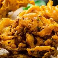 Onion Bhajia Appetizers · Thinly sliced onion fritters.