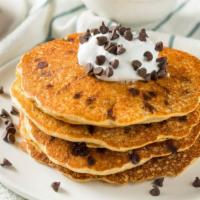 Chocolate Chip Pancakes · Pancakes made with delicious chocolate chips melted throughout, served with butter, whipped ...