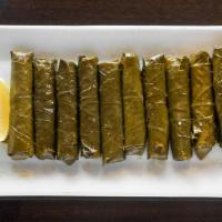 Vegetarian Grape Leares · Grape leaves rolled and stuffed with rice, chickpeas parsley and tomatoes flavored with spic...
