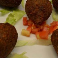 Kibbe Balls · Stuffed with meat and nuts, and deep fried.