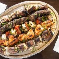 Mashawi For 4 · Charbroiled lamb, beef, chicken, kafta and vegetables served with rice and french fries.