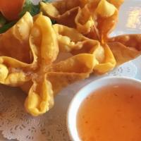  Thai Crab Rangoon · A crispy wonton shell wrapped in crab meat & cream cheese served with sweet sauce