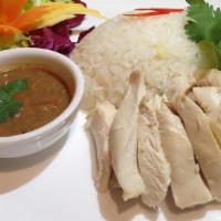 Chicken Breast Rice · Chicken breast on garlic & ginger oily rice, cucumber, Scallion & cilantro and soup.
