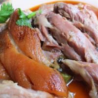 Kha Moo (D) · Pork hock stew w/ preserved veg, soy egg, intestine. rice