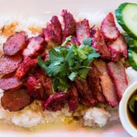 Moo Deang On Rice · Jasmine rice w/ BBQ pork, sweet sausage and soy egg.
