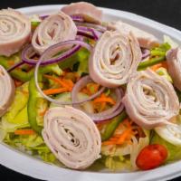 Chef Salad · Turkey, ham, swiss cheese, lettuce, tomatoes, carrots, cucumbers, green peppers, onions.