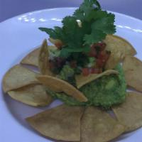 Guacamole - Large · Handmade with fresh avocado, jalapeño peppers, onions and lime juice, garnished with pico de...