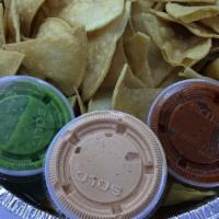 Chips & Salsas · Homemade tortilla chips accompanied with a side of green tomatillo, chipotle cream, and chil...