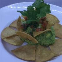 Guacamole - Small · Handmade with fresh avocado, jalapeño peppers, onions and lime juice, garnished with pico de...