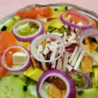 San Lucas Salad · Iceberg lettuce, avocado, tomatoes, cucumbers, queso fresco, and radish. Served with our hom...