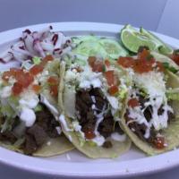 Beef Tacos (4 Pcs.) · With shredder top round beef. Served with diced onions, cilantro and with homemade corn tort...