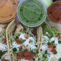 Fish Tacos (4 Pcs.) · Breaded tilapia filet with shredded lettuce and pico de gallo. Served with diced onions, cil...