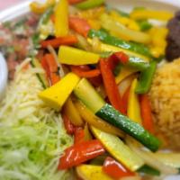 Fajitas Vegetarian · Vegetarian. Sautéed bell peppers, zucchini, squash and onions accompanied with shredded lett...