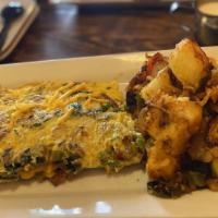 Chorizo Omelette · Made with grilled chorizo, fajita vegetables, mild cheddar cheese, jalapeños. Served with ho...
