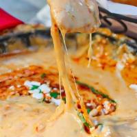 Queso Fundido · Chihuahua fondue | fire roasted chiles | Oaxaca cheese | cotija cheese | cilantro hatch chil...