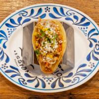 Chicken Tinga Taco · chile marinated chicken | sweet onions | cilantro |  cotija cheese