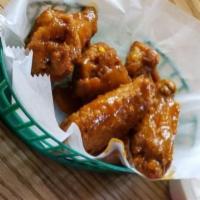 Boneless Chicken Wings · Crispy fried naked or tossed in buffalo sauce.