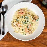 Gulf Shrimp Linguine · Pesto garlic cream sauce Parmesan cheese, baby spinach.