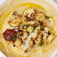 Roasted Cauliflower Hummus Bowl · Original hummus drizzled in olive oil and spices served with roasted cauliflower, tahini, an...