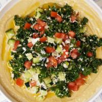 Tabbouleh Hummus Bowl · Original hummus drizzled in olive oil and spices served with tabbouleh, tahini, and a side o...
