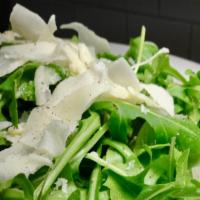 Insalata Di Arugula Parmigiana · Arugula salad tossed with oil and balsamic vinaigrette dressing, topped with shaved Parmesan...