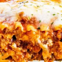 Lasagna Al Forno · Old world style with layers of ground beef, ricotta cheese & mozzarella.