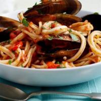 Linguine Frutti Di Mare · Mussels, calamari & crabmeat fresh tomato sauce.