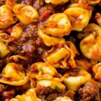Tortellini Bolognese · Our rich meat sauce.