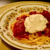 Spaghetti Alla Norma · Fresh tomato sauce with eggplant topped with ricotta.