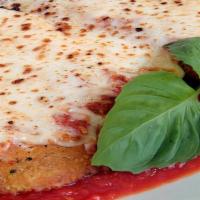 Veal Parmigiana · Lightly breaded tender veal cutlet topped with fresh tomato sauce & mozzarella. Choice of pa...