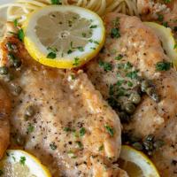 Chicken Piccata · Sautéed breast of chicken in lemon butter sauce with copped tomatoes and capers. Side of pas...