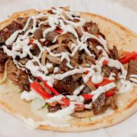Lamb Gyro · Cooked on a spit and wrapped in a pita.