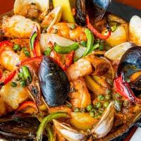 Seafood Paella · For one. Scallops, calamari,shrimp, mussels, fish, Valencia rice cook in a fish and saffron ...