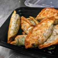 Veggie Dumplings (7Pc) · Crispy Air Fried Vegetable Dumplings Filled With (spinach, carrots, cabbage, corn, mushroom)...