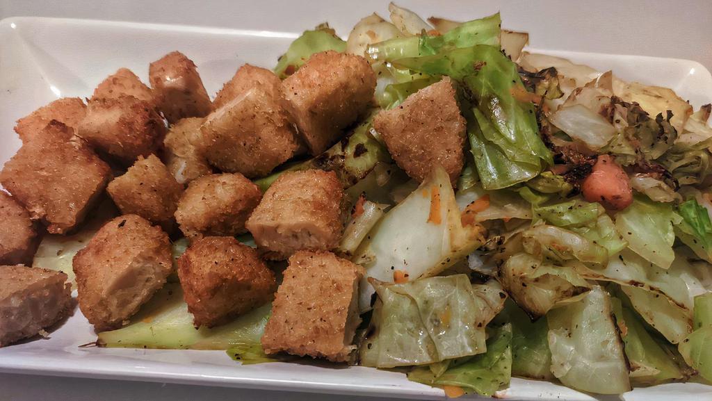 Tenders With Stir Fry Cabbage · Soul Food Inspired Stir Fried Cabbage Mixed With Carrots And Seasoned. Also Topped With Chik'n Tenders(We Leave The Animals Alone) 
***Optional Vegan Habanero Sauce
(Calories 280)