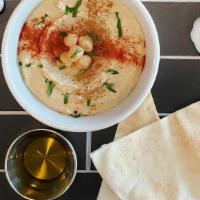Hummus · Our delicious and tasty homemade hummus made with the best chickpeas in the market. The mix ...