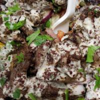 Shawermah Salad · Beef & lamb Shawermah, romaine lettuce, grape tomatoes, bell peppers, cucumbers, red onions,...