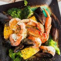 Crab Bowl · Dungeons or Alaskan crablegs, served in garlic butter sauce, paired with shrimps and mussels...