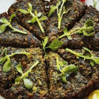کوکوسبزی / Kookoo Sabzi · Green herbs, garlic, black pepper lettuce, tomatoes, pickles and vanak sauce.