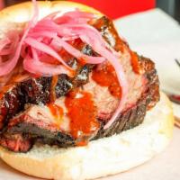 Beef Brisket Sandwich · Served on Fresh Pub Roll w Topping of BBW's Tasty Housemade Pickled Onions (optional), pickl...