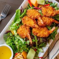Coconut Shrimp Salad · A bed of mixed field greens, mandarin oranges, craisins, sliced almonds, a sprinkle of cocon...