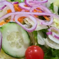House Salad · Crisp lettuce, tomatoes, mixed green and choice of dressing.