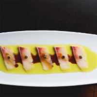 Kanpachi Carpaccio · Marinated in chive truffle oil and aged yuzu soy.