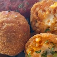Mini Arancini Balls · These little arancini balls are filled with rice and cheese with a side dipping sauce of mar...