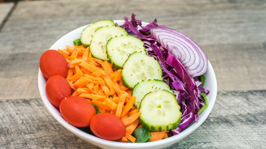 Garden Salad · Romaine, spinach, purple cabbage, carrots, red onion, cucumbers, and grape tomatoes.
