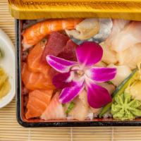 Chirashi · Chef's choice assorted 14 pieces sashimi on a bed of sushi rice. Consuming raw or undercooke...